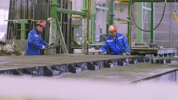 Workers loading ferroconcrete panel's forms