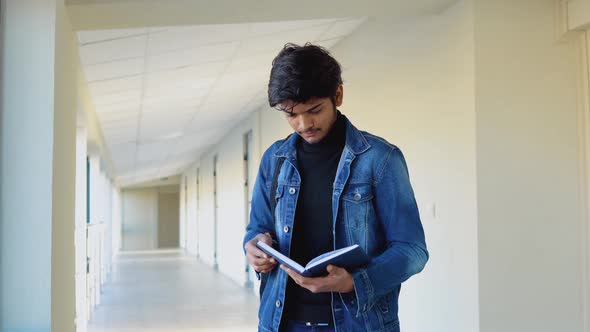 Indian Student with a Books in the University