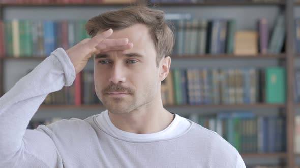 Searching Gesture By Adult Man in Office