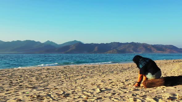 Tourist sunbathing on paradise tourist beach lifestyle by turquoise water with white sand background