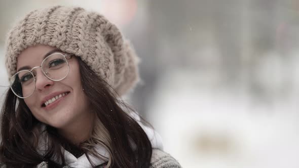 Portrait of Pretty Woman with Glasses at Winter Smiling Face Closeup Outdoors Shy and Playful