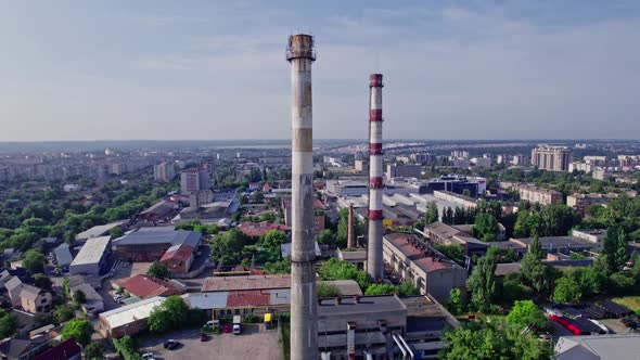 A City with Residential Buildings and a Large Pipe