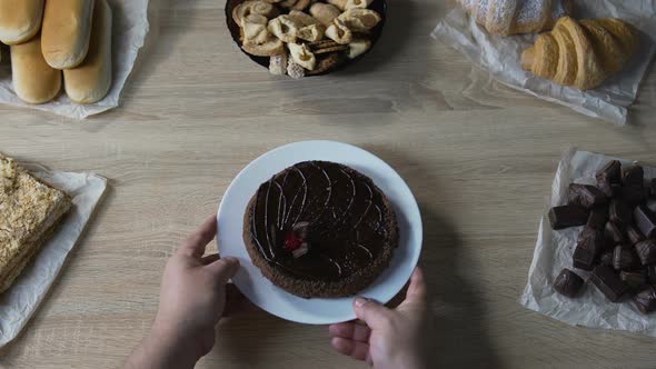 Fat Man Putting Plate with Sweet Chocolate Cake on Table, Risk of Diabetes