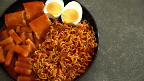 Korean instant noodles with Korean rice cake and fish cake and boiled egg - Rabokki - Korean food st