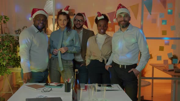 Slow Motion Portrait of Happy Businesspeople Diverse Group Celebrating New Year in Office