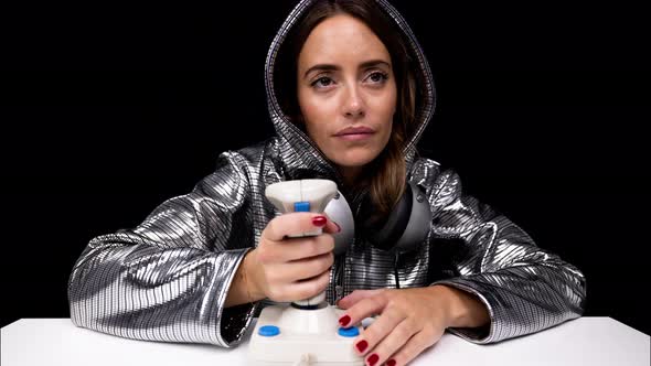 Woman with Silver Hoodie with Arcade Joystick