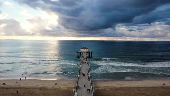 Beautiful cinematic aerial shot over Manhattan Beach and pier in California