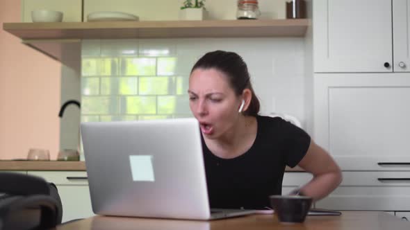 Young Woman with Laptop at Home. Big Stress From News, Unemployment Email, Online Fraud