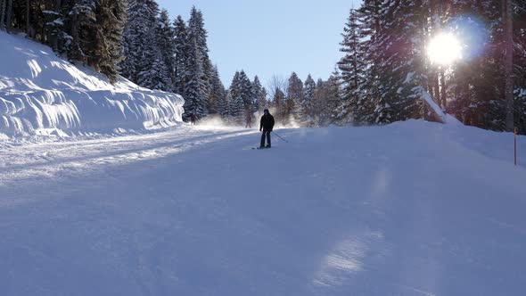 Skier Skiing Down On Ski Slopes On Ski On Sunny Winter Day Background Sunlight