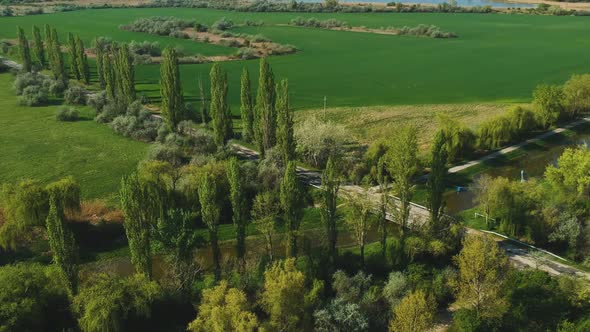 Afternoon countryside naturescape drone view from high altitude with upwards camera movement. ( DJi