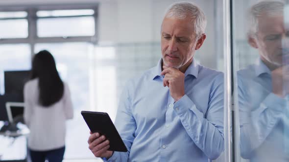 Man using digital tablet at office