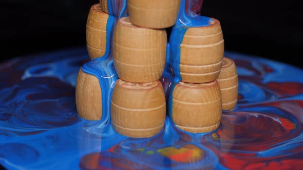 Wooden Barrels Doused with Multicolored Paints