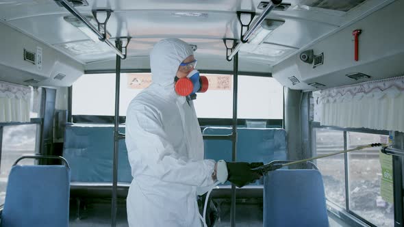 Disinfector in Protective Suit, Disinfection Inside Public Urban Transport, Bus