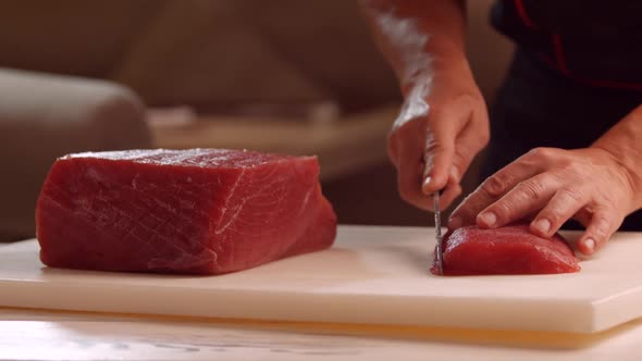 Hands with Knife Cut Meat.