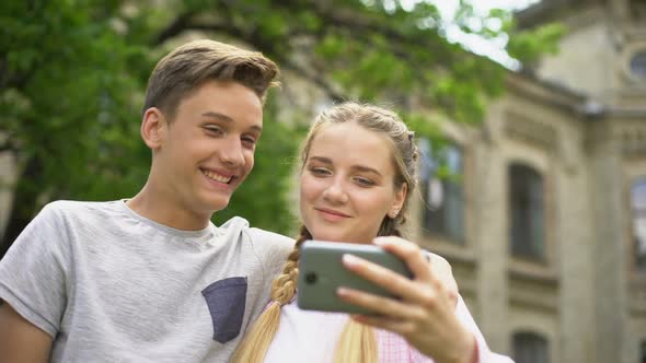 Couple of Teens Making Selfie, First Kiss, Feelings of Embarrassment, Pure Love