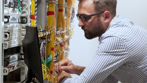 Engineer Working in Data Room