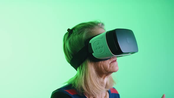 Old Greyhaired Woman Using VR Headset