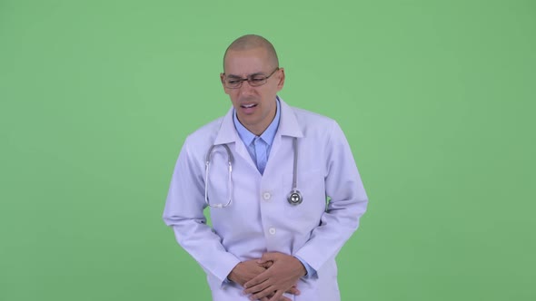 Stressed Bald Multi Ethnic Man Doctor Having Stomachache