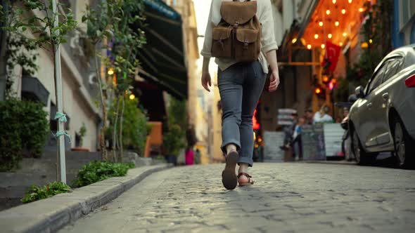 Walking young girl with a backpack on vacation in Istanbul