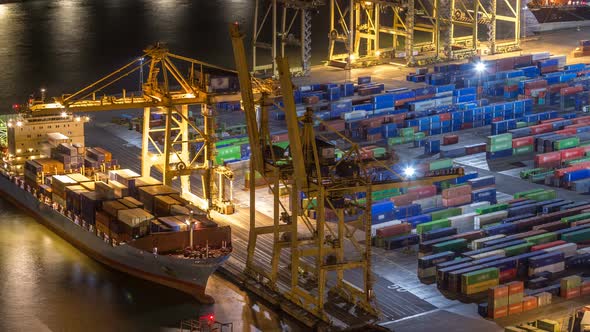 Seaport and Loading Docks at the Port with Cranes and Multicolored Cargo Containers Night Timelapse