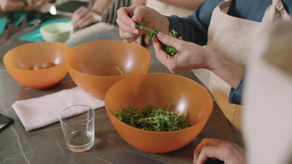 Tearing Arugula Leaves While Cooking