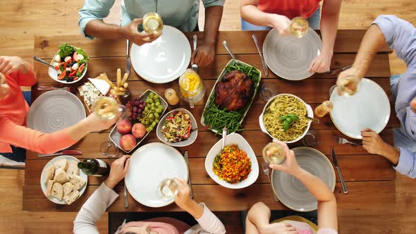 Group of People Eating and Drinking Wine at Table 13