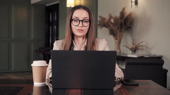 Young Businesswoman Talking to Business Partner Through Online Connection