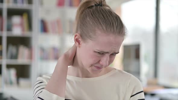 Portrait of Exhausted Young Woman with Neck Pain