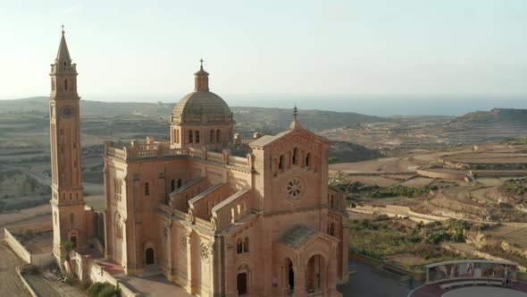 Ta Pinu Church Sand Beige Colored Basilica on Gozo, Malta in Beautiful Afternoon Sunlight, Aerial