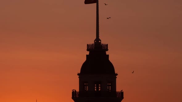 Close Up Silhouettes of The Maidens Tower and Galata Tower In Yellow Sunset