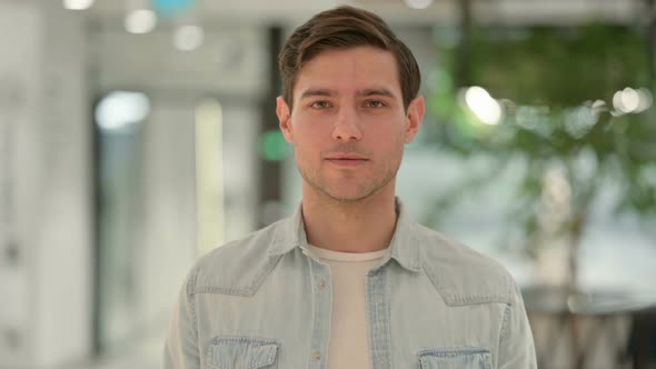 Portrait of Creative Young Man Looking at Camera