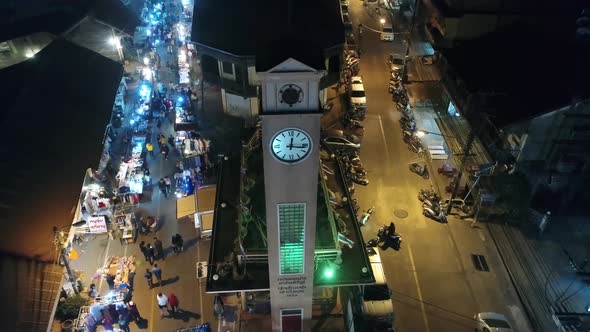 Aerial Footage of The Vietnamese Memorial Clock Tower in Nakhon Phanom Province, Thailand Surrouned