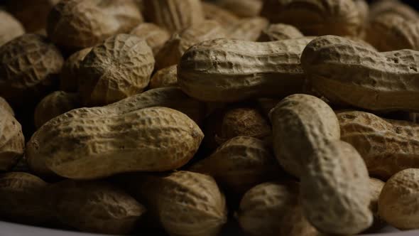 Cinematic, rotating shot of peanuts on a white surface - PEANUTS 030