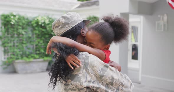 Animation of happy african american soldier mother and daughter hugging and embracing