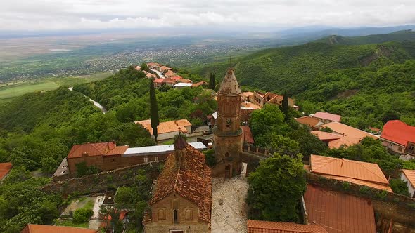 Gorgeous aerial view of St George church in Signagi town with Alazani valley