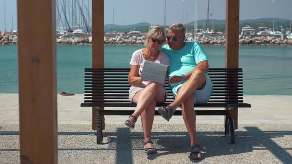 Senior Family Couple with Pad on Waterfront