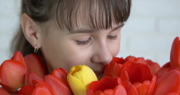 Child with romantic bouquet. 