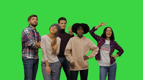 Young People Showing Off Posing for a Photo on a Green Screen Chroma Key