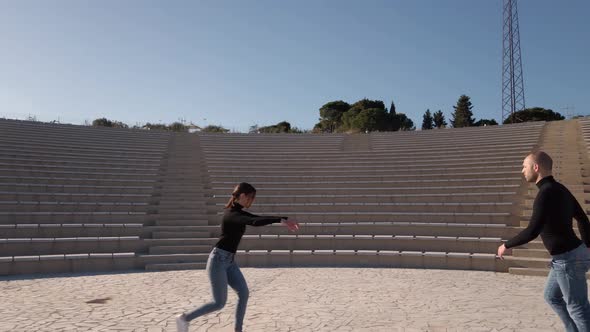 Dancers dance in an theater