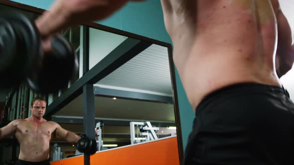 Man lifting a heavy dumbbell