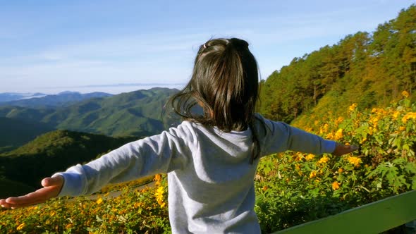 Close-up beauty girl extend the arms on mountain peaks