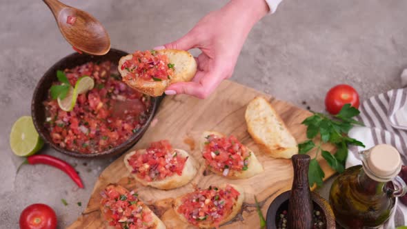 Making a Vegan Healthy Breakfast  Spreading Tomato Salsa on Whole Grain Bread