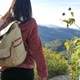 Hiking woman trekking in flora hill with backpack. Rear back view of female - VideoHive Item for Sale