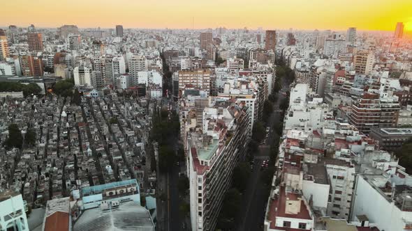 Aerial parallax shot of Recoleta district and cemetery in Buenos Aires at sunset