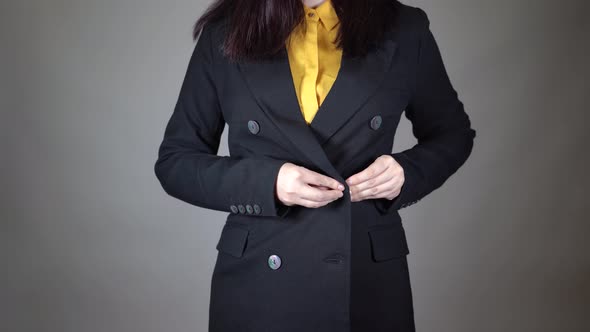 Front View on Body Part of Young Female in Yellow Blouse and Black Jacket