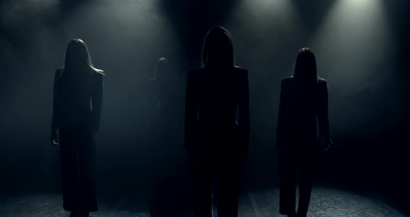 The Camera Moves Away From the Girls Dancers in the Dark