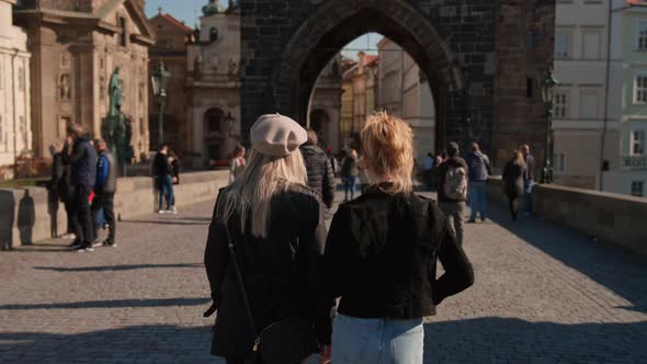 Tourists Walking on the Charles Bridge Towards the Old Town Tower