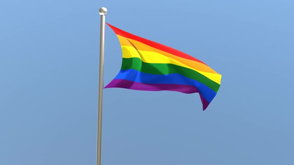 LGBT flag on flagpole.