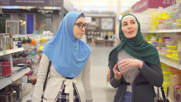 Two Young Muslim Women in Supermarket in Home Goods Department
