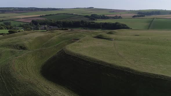 Aerial of the eastern gate of the iron age hill fort, Maiden Castle. Fields in the surrounding lands